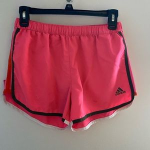 Pink Adidas shorts in a size medium.